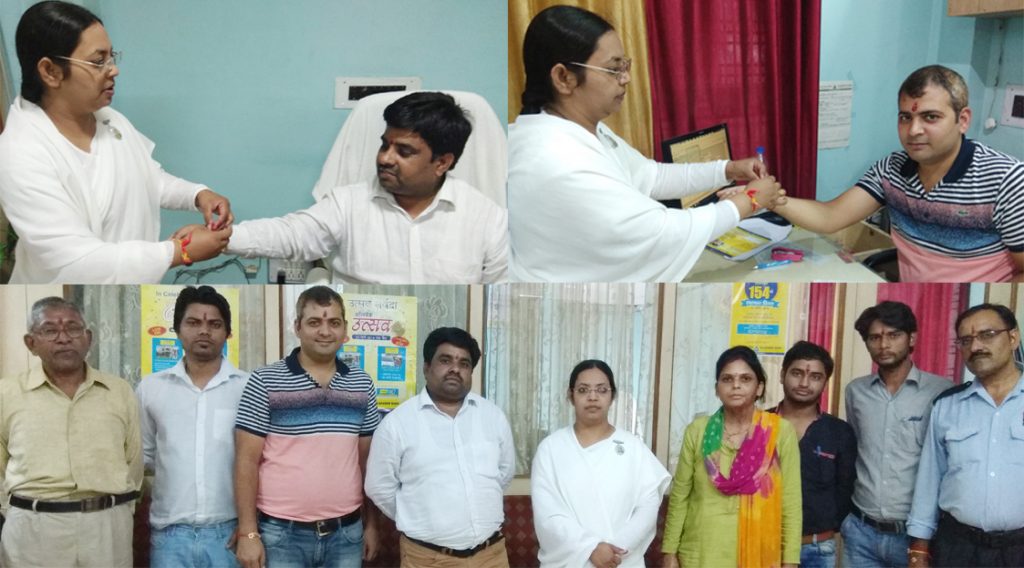 BK Monika tying Rakhi to Mr. Faseem Khan (Branch Manager of Allahabad Bank) and all staff members.