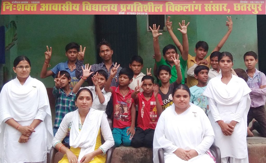 BK Rama interacting with disable children of Pragatisheel Organization and tying Godly Rakshasutra.